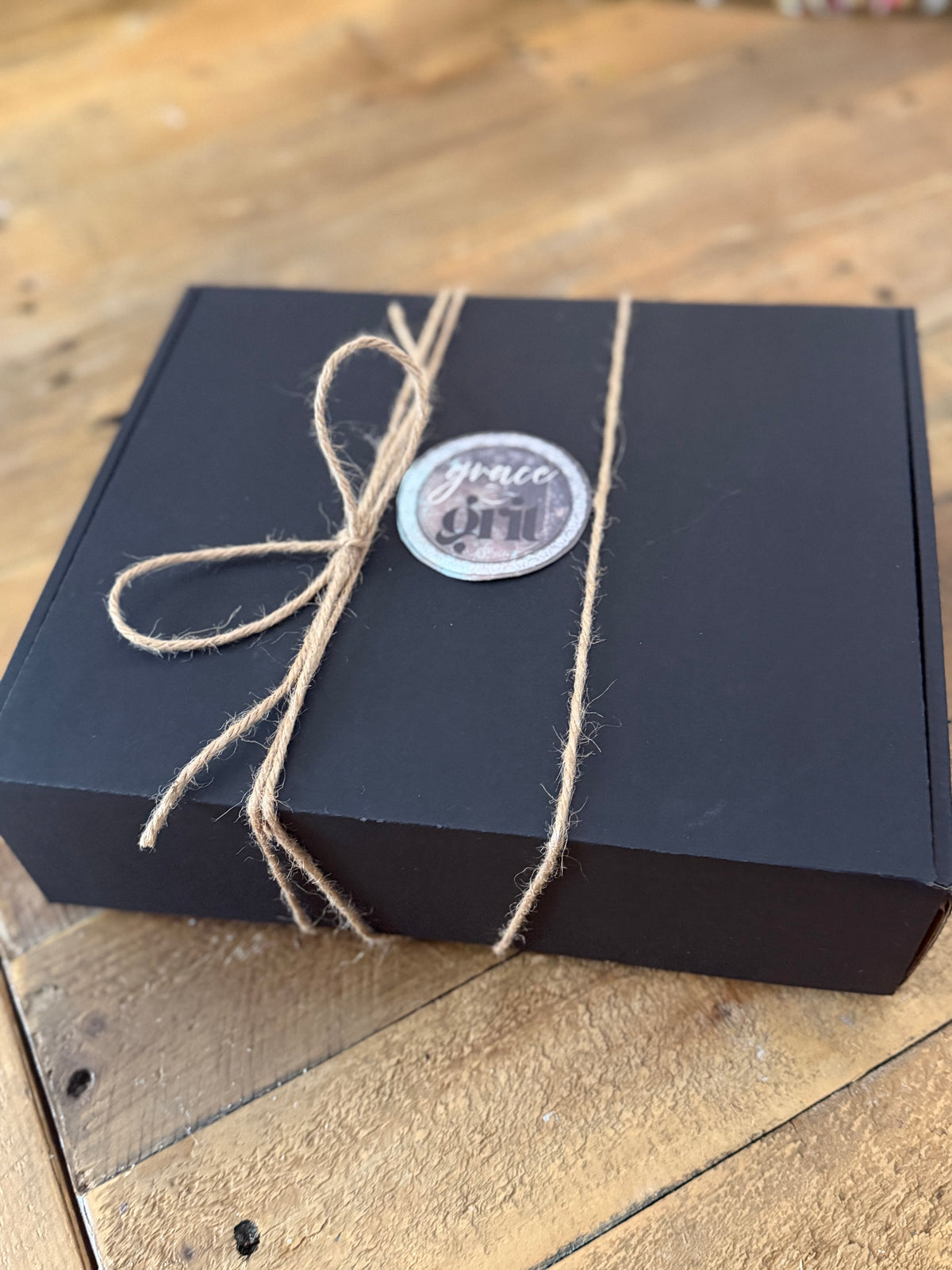 True North Gift Box – Trucker Hat, Teton Stone Cross Necklace & 5×7 “You Will Rise Again” Art