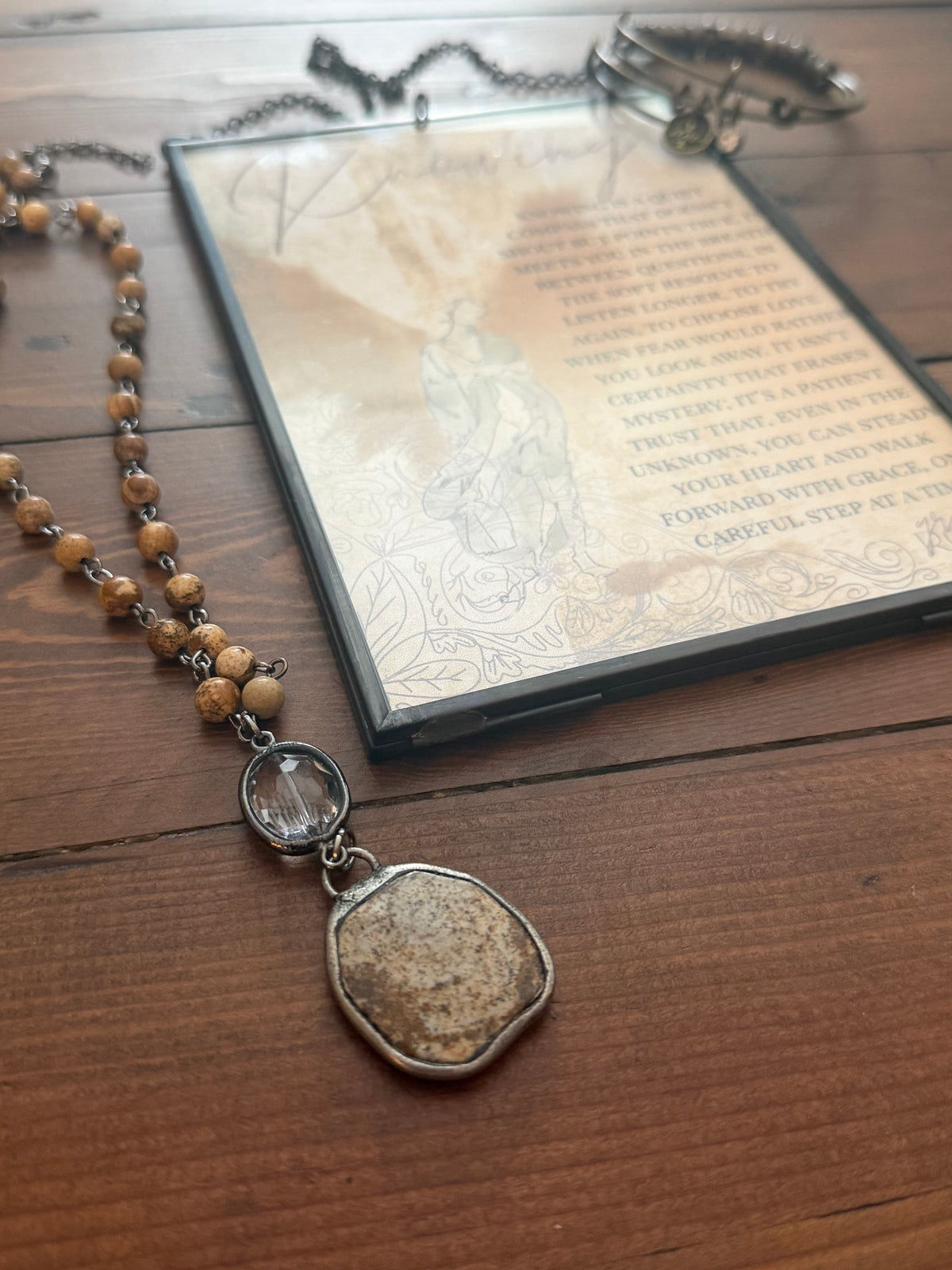 Necklace with a pendant on a wooden surface